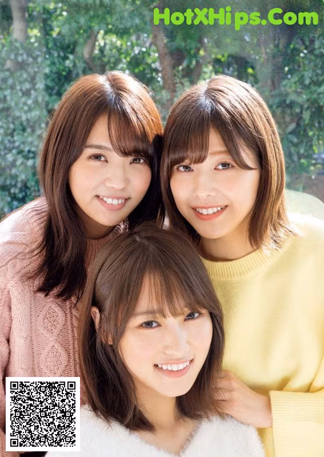 A group of three young women posing for a picture.